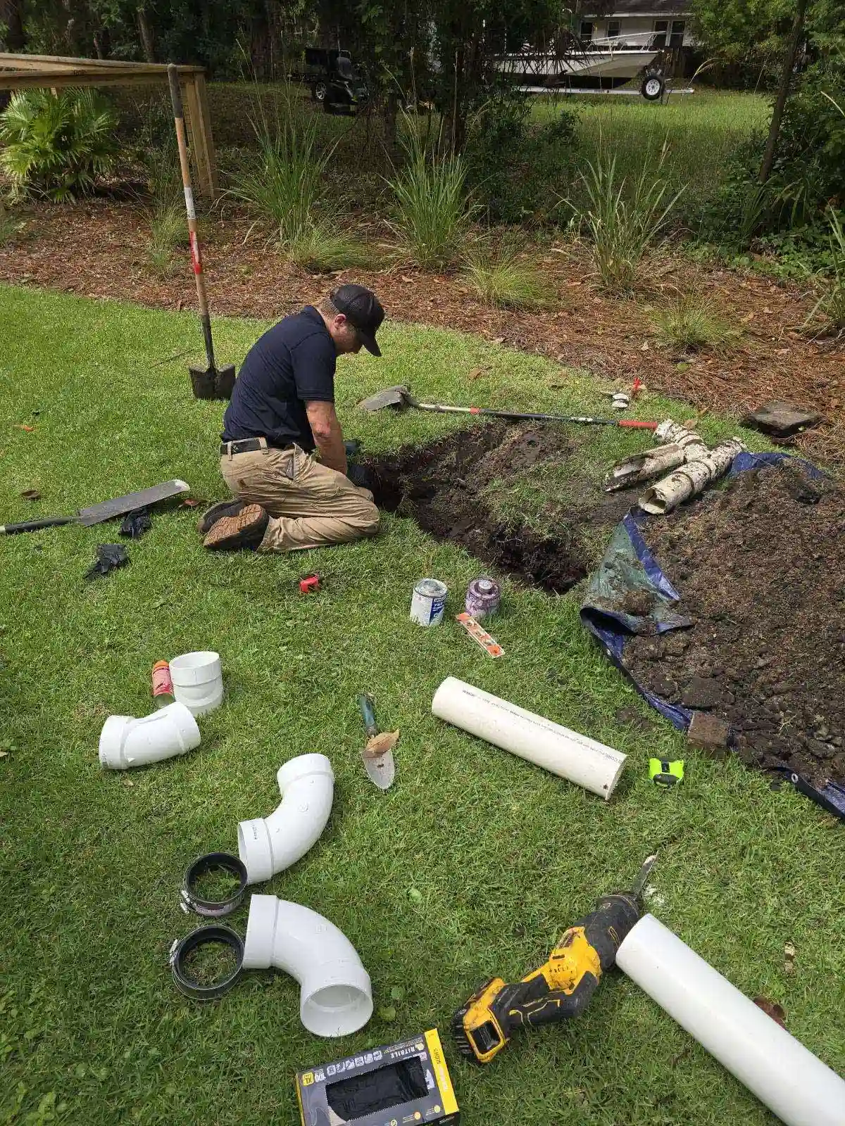 Person working on septic tank repair